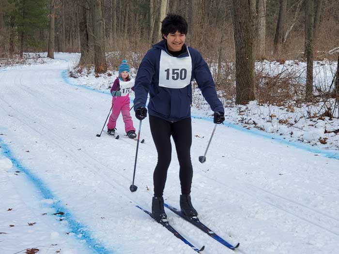 Krazy Klassic  cross country ski racers on the course - 12k'er Joseph Brebeck laps 5k'er Avery Newmister